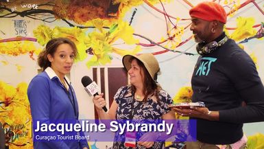 The Donna Drake Show travels to the Curaçao booth and paints with Francis Sling